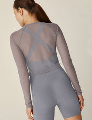 gray long sleeve mesh cropped top.