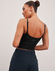 black midway length tank top with adjustable spaghetti straps.