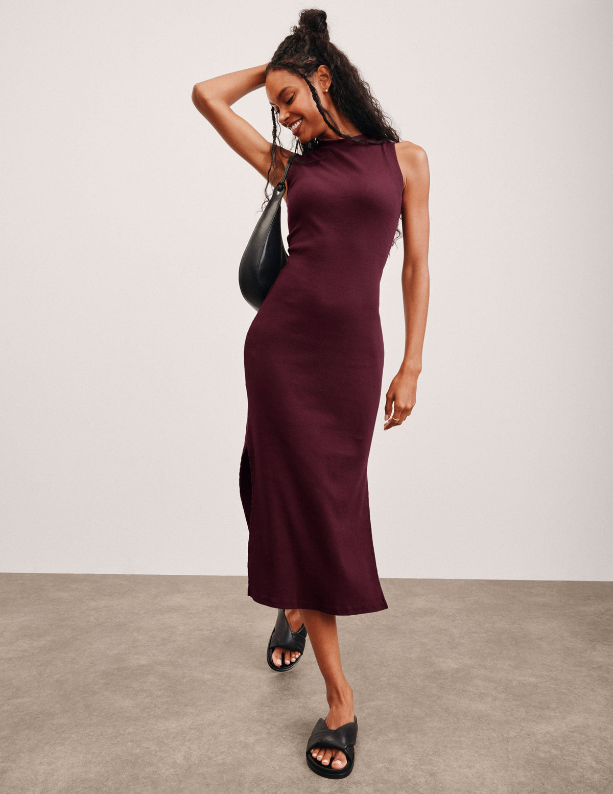 red midi length ribbed dress with side slits and a mock neckline.