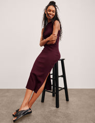red midi length ribbed dress with side slits and a mock neckline.