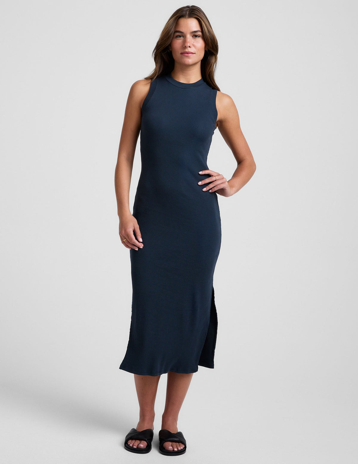 blue midi length ribbed dress with a side slit and mock neckline.
