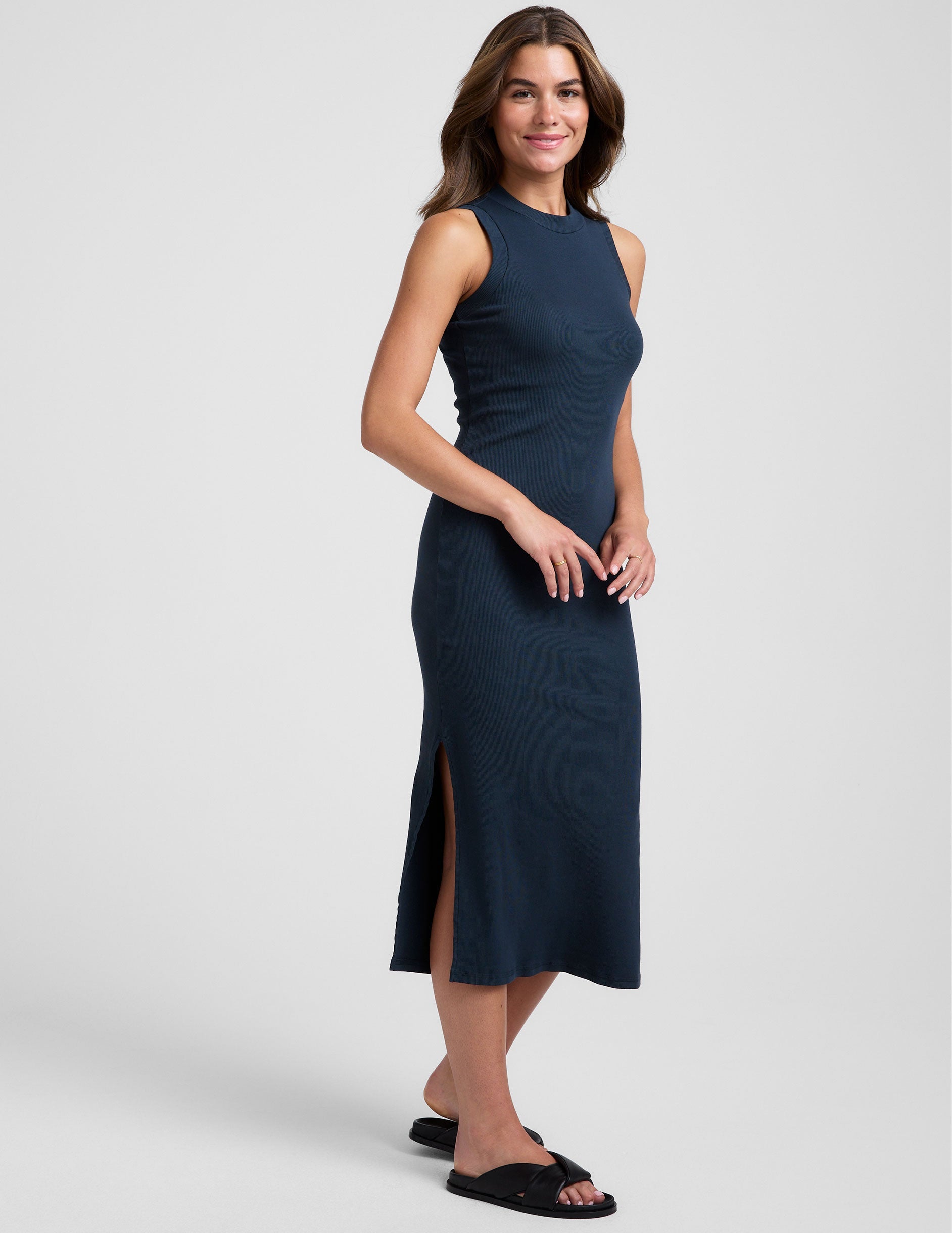blue midi length ribbed dress with a side slit and mock neckline.