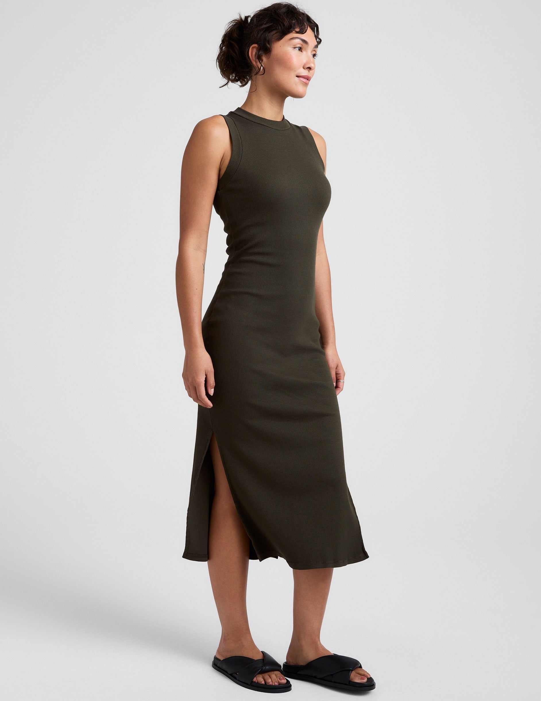 green midi tank dress with side slits and a mock neckline.