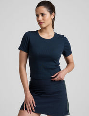 blue ribbed cropped top with a scoop neckline.