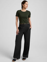 green ribbed cropped top with a scoop neckline.