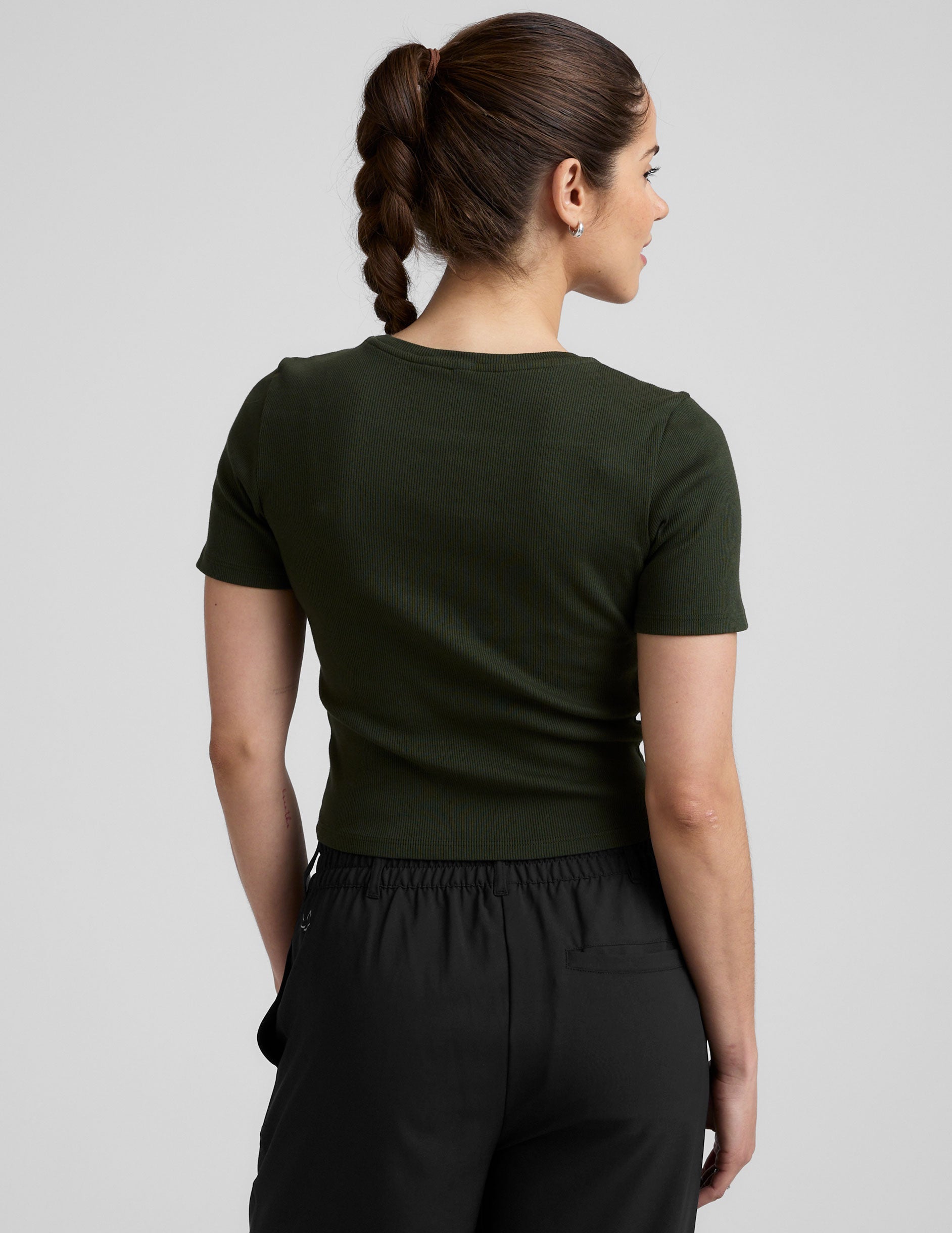 green ribbed cropped top with a scoop neckline.