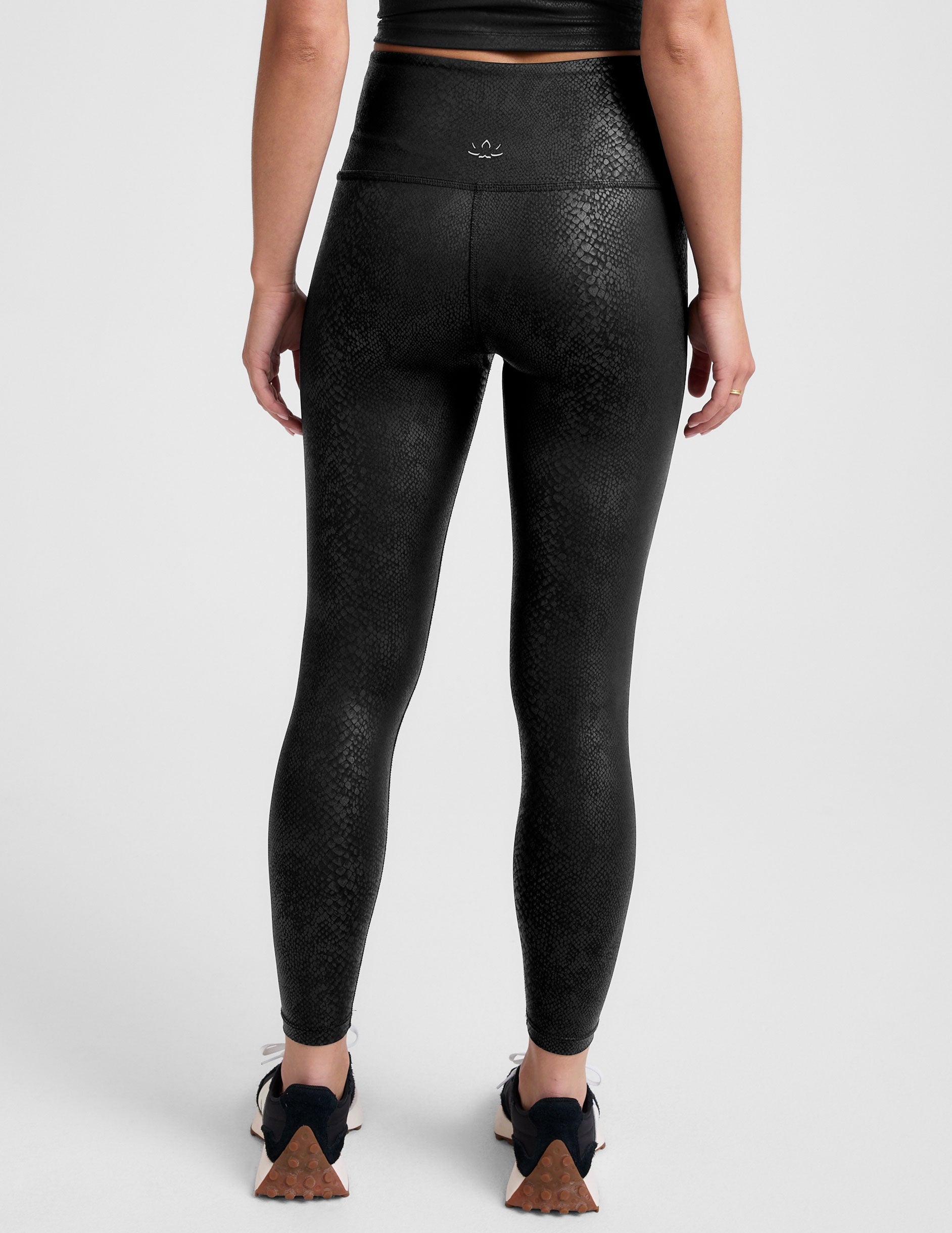 black viper print high-waisted midi leggings.