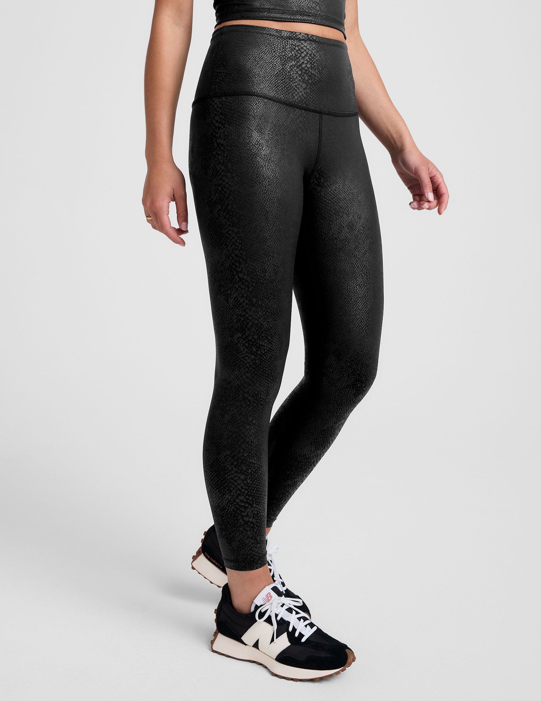 black viper print high-waisted midi leggings.