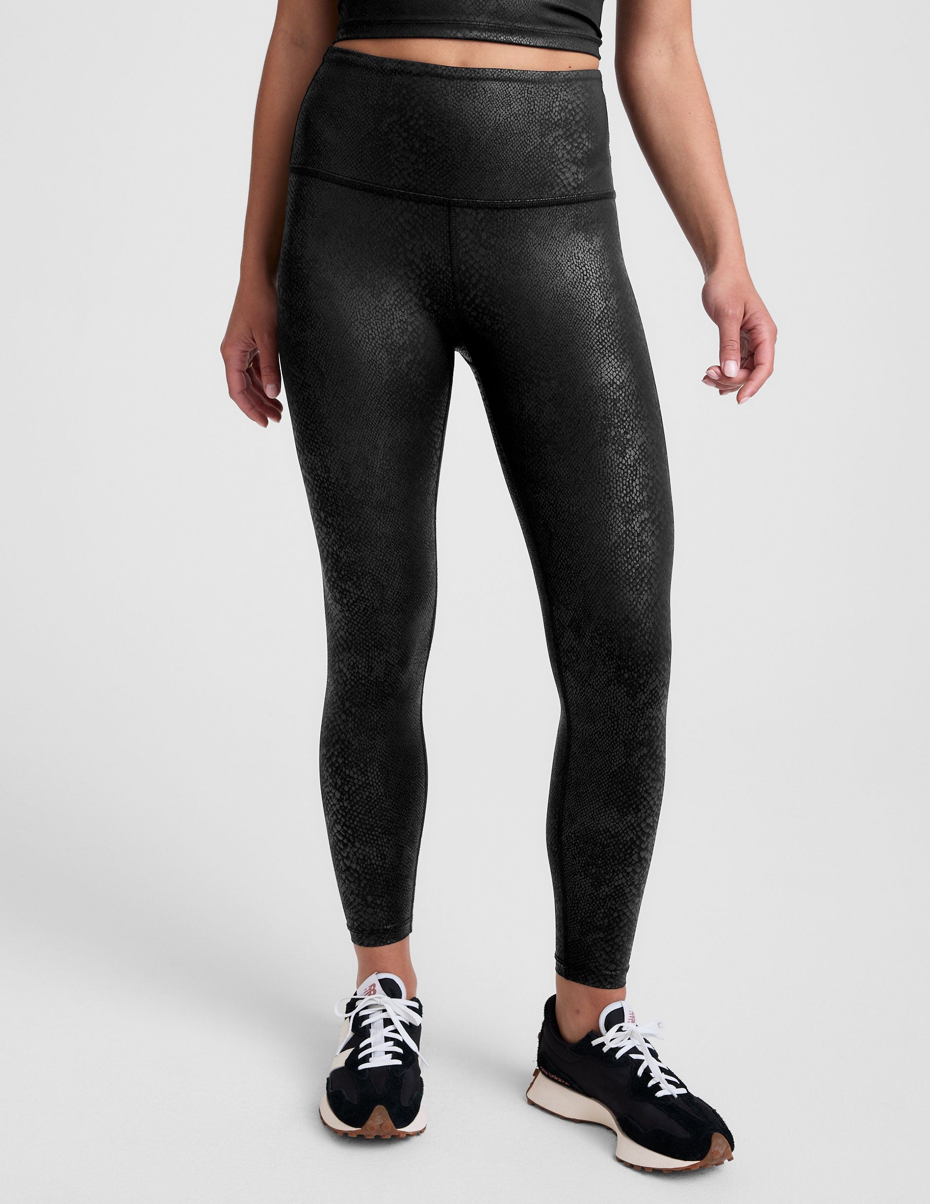 black viper print high-waisted midi leggings.