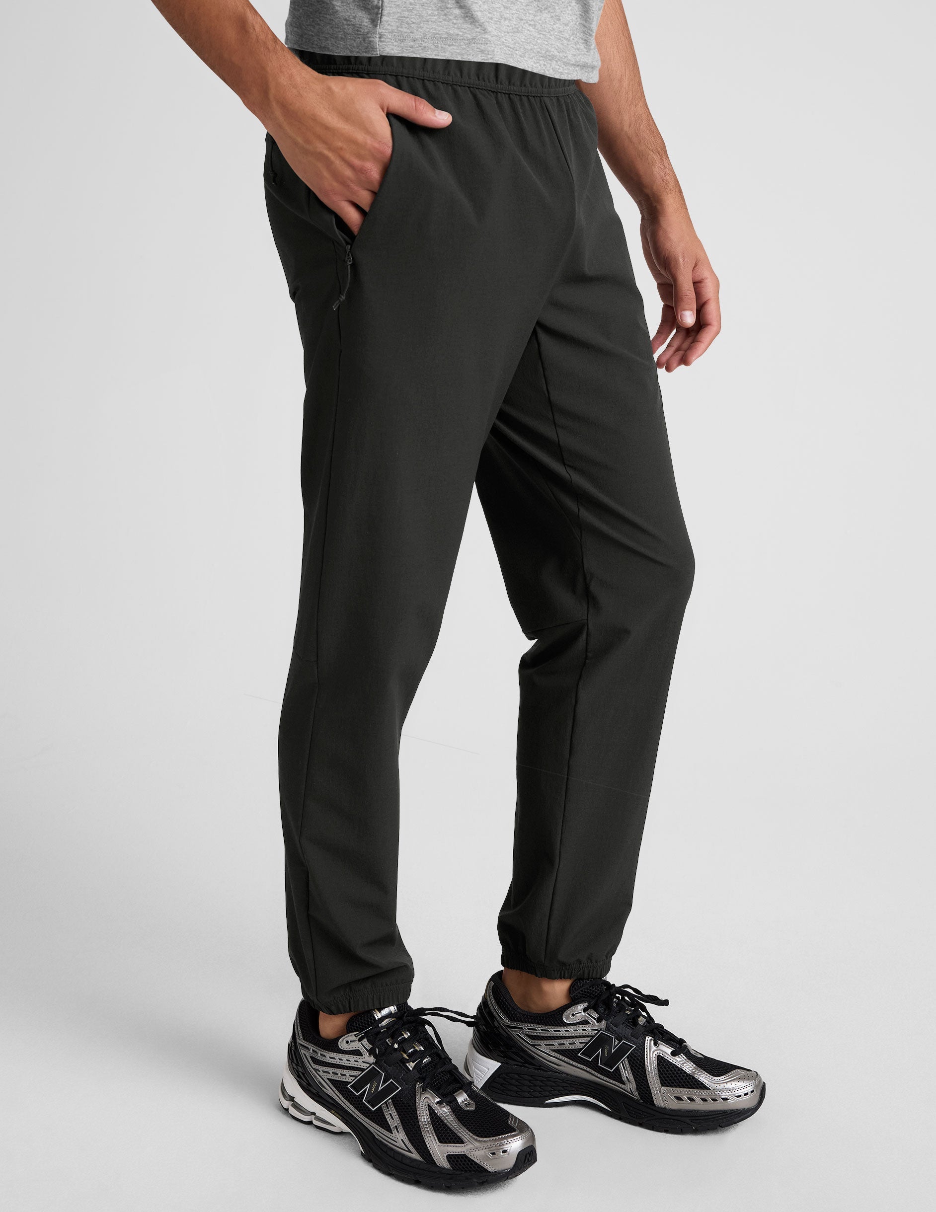 black men's joggers on a plain background.