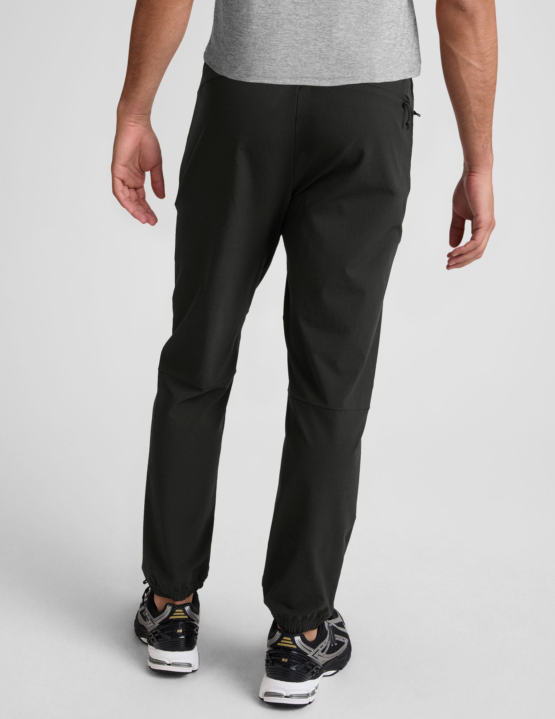 black men's joggers on a plain background.