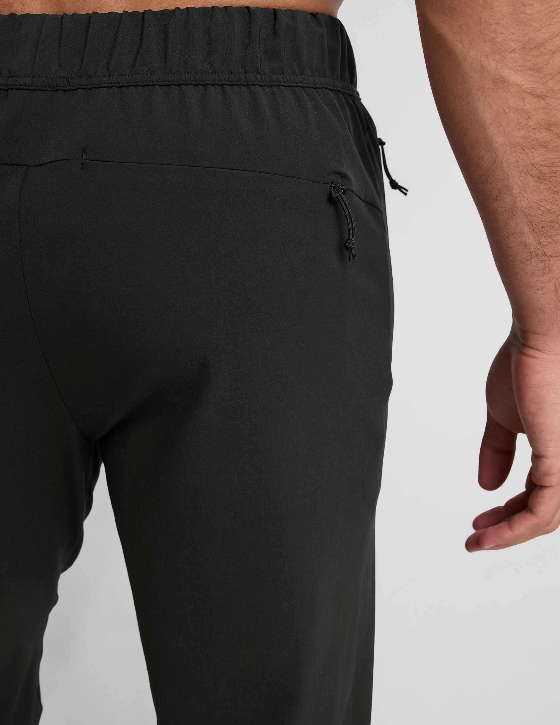 black men's joggers on a plain background.